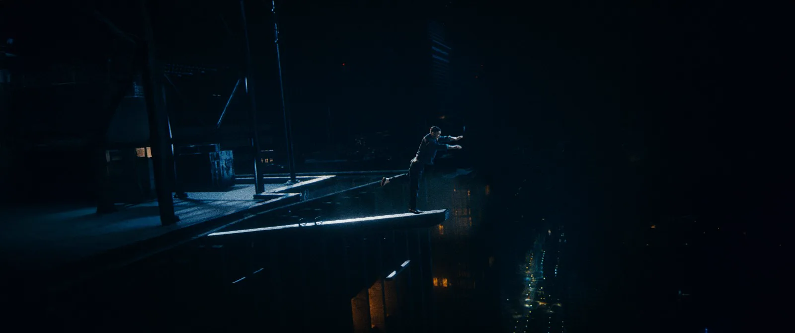 Finished widescreen frame of Rhys on the pommel horse above The Leap cityscape